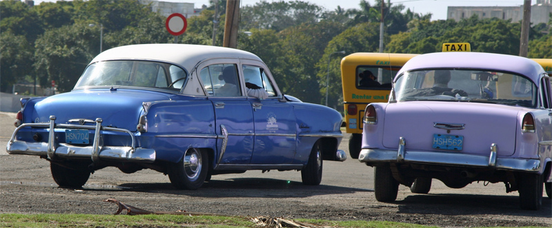 same two cars from behind