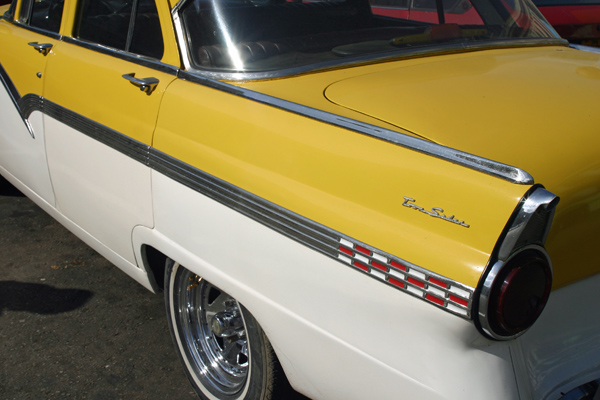 back of yellow and white Ford