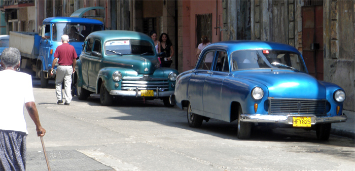 blue and green cars (green car pre 1950 Ford)