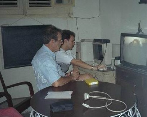 Emilito with Jose Antonio at his computer