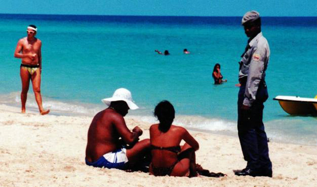 Police interviews couple on
          beach