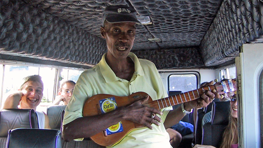Calypso singer on bus at lookout