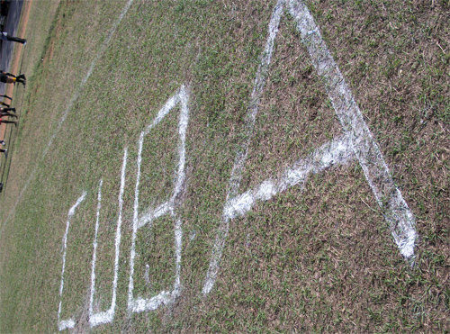 Cuba in chalk on grass
