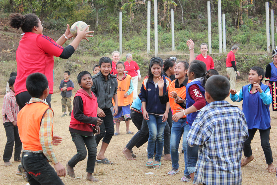 Dot playing with Hmong kids